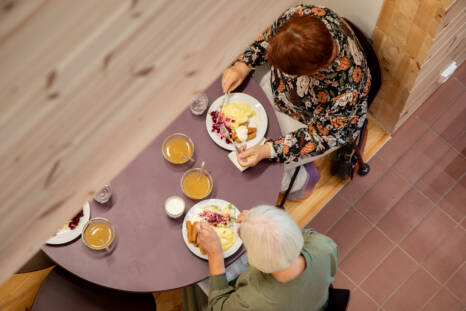 Elderly people dining at Monio's table